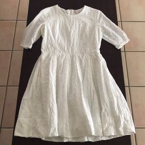 White dress with beautiful details .